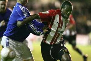 At the double: Brentford's Myles Weston tussles with the Gateshead defence in Tuesday's 5-2 FA Cup triumph.
