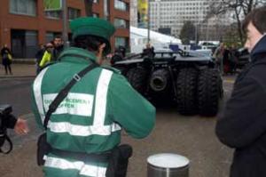 A Lambeth parking warden writes out a ticket