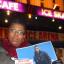 Tracey Ford holds a picture of her son outside the ice rink where he was murdered
