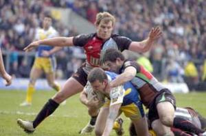 Chad Randall and Luke Williamson get to grips with Lee Briers