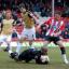 Frustrated: Bees striker Ben Strevens can't beat MK Dons keeper Willy Gueret to the loose ball in Saturday's 3-3 draw at Griffin Park.