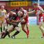 Try-scorer Danny Ward is stopped in his tracks