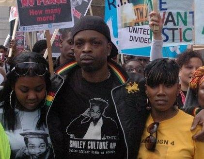 Merlin Emmanuel (centre) has said he will continue to challenge police over his uncle's death