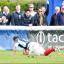 The moment of truth: Scottish centre Charlie Hayter scores the try that secured safety