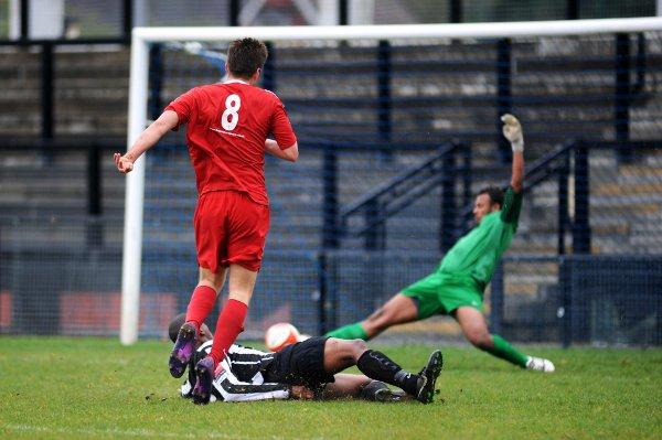 Familiar feeling: Tooting are powerless to prevent another Bury goal on Saturday