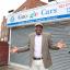Kaz Odutayo outside Gooogle Cars in Streatham High Road.
