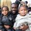 Theo Field Pellew with daughter Teniyah, 3, and Tyrelle, 2.
