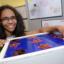 Kirsty Wilcox with her project - a cupboard and games resource for children