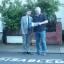 Coun Davies and John Higgins with the permit at the disabled parking bay.