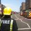 A firefighter surveys the scene as crews cordoned off the area.
