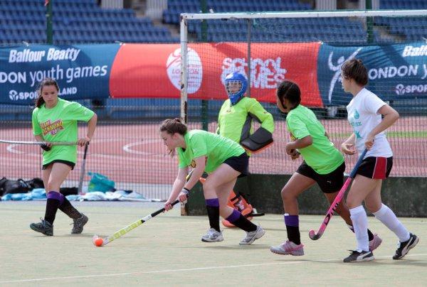 Solid defence: Richmond's hockey girls clear their lines at the Crystal Palace National Sports Centre last week