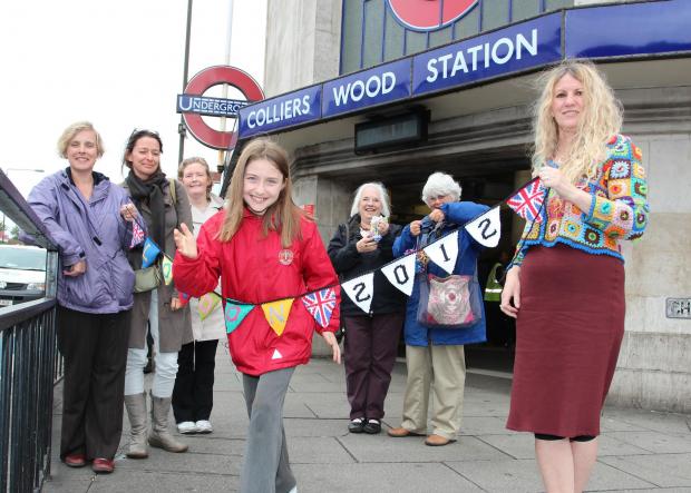 Knitters, led by 'yarnaholic' Ruth Herring (right) pledge to spruce up Colliers Wood for Olympic parade