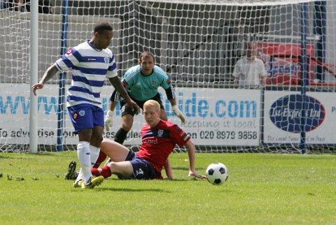 Streatham Guardian: Going back to my roots: Former Brentford striker DJ Campbell leads the Hampton defender Alan Bray a merry dance on Saturday as keeper Craig Ross looks on Streatham Guardian: Going back to my roots: Former Brentford striker DJ Campbell leads the Hampton defender Alan Bray a merry dance on Saturday as keeper Craig Ross looks on