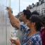 Community mural created in burnt-out fancy dress shop