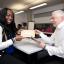 Cherish Anyanwu with Lambeth College's head of science, John James