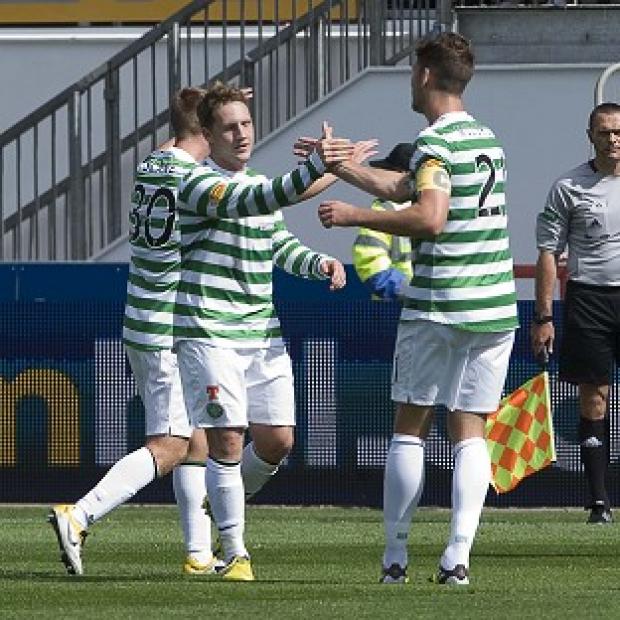 Kris Commons, centre, rescued a point for Celtic with a late equaliser