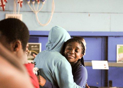 Students hug after opening results at Dunraven School.