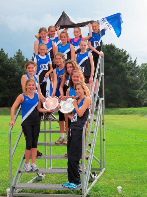 Well done: The Kingston & Poly Athletics Club double-winning Lily League girls team celebrate with their silverware