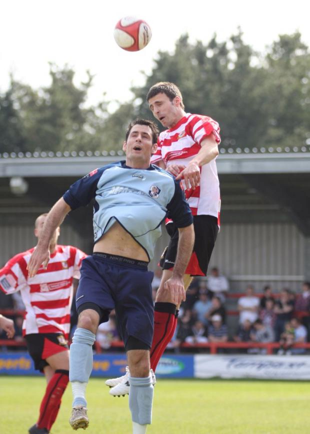 Max Hustwick in his days as a Kingstonian defender, now he is leading the back line at the Beveree