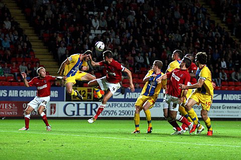 Glenn Murray heads the ball back across the box