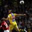 Glenn Murray beats Danny Hollands to a header
