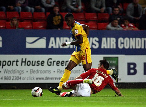 Rhoys Wiggins slides in on Wilfried Zaha