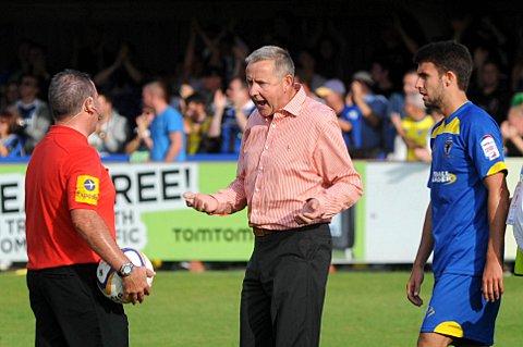 Red rage: Terry Brown vents his anger at the referee in red during the Dons' 2-1 defeat to Rochdale on Saturday SP68731
