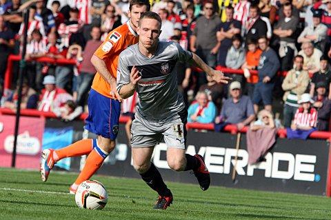 On target: Brentford's Adam Forshaw - playing in silver to mark the 25th anniversary of the Brentford Community Sports Trust - struck to give the Bees three points on Saturday