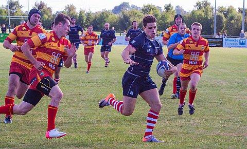 On the run: Charlie Broughton races for the line in the National League One win over Cambridge