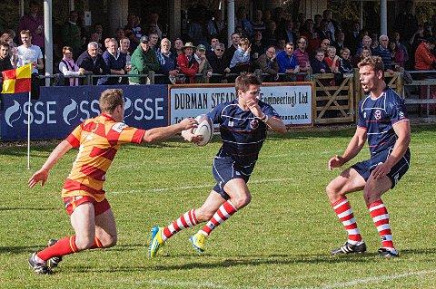 Get out the way: Matt Heeks charges through the Cambridge lines on his way to scoring, as Steve Hamilton (right) looks on                      David Whittam