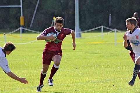 Charging through: Chris Geary rushes through the Old Emanuel defence      Stephen Lynch