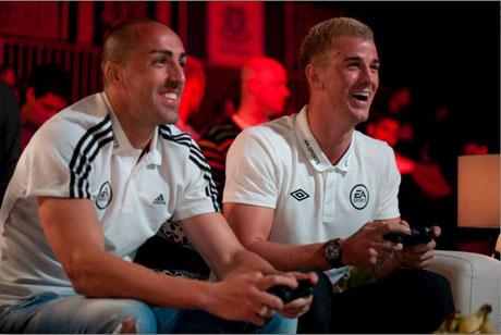 Liverpool's Jose Enrique playing Manchester City's Joe Hart during the Fifa 13 Celebrity Cup