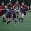 On the charge: Sutton & Epsom's Steve Warnham takes on the Chobham back line