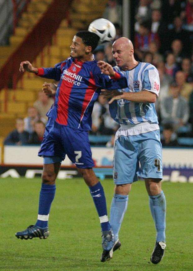 Unconfirmed: Robert Page (in action for Coventry City) has not been unveiled as the new Dons manager