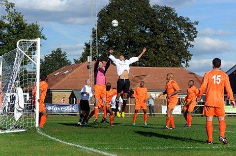 Rising from the dead: Joe Grant gets up against the Croydon defence on Saturday - only the club's second home game of the season