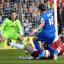 Door slammed shut: Jack Midson dallied when through one on one with the keeper, allowing Cheltenham's Keith Lowe the time to get back     SP70799