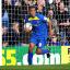 In a hurry: Byron Harrison plays ball boy after scoring the Dons' consolation... he went on to almost grab an unlikely equaliser               SP70799