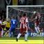 Old friend: Former Dons man Kaid Mohamed heads home Cheltenham's second goal              SP70799-11