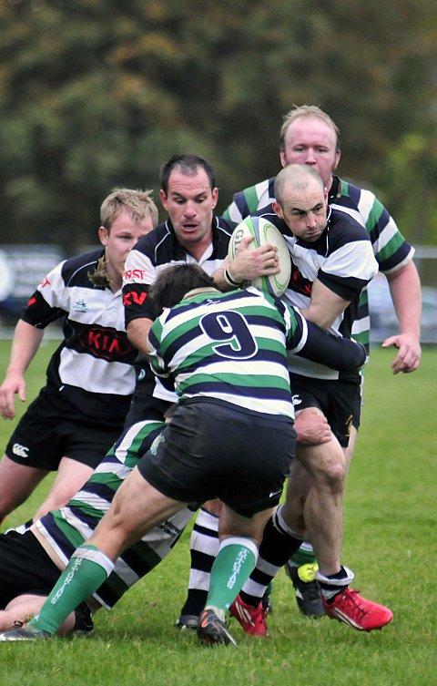 Barging through: Sutton &amp; Epsom’s Mike Cartledge tries to break through the Old Tottonians’ defence      SP70814
