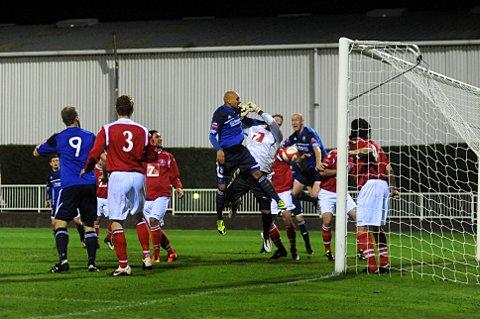 Down and out: Met Police midfielder Tyron Smith gets up at a corner in last night's FA Trophy defeat to Leiston