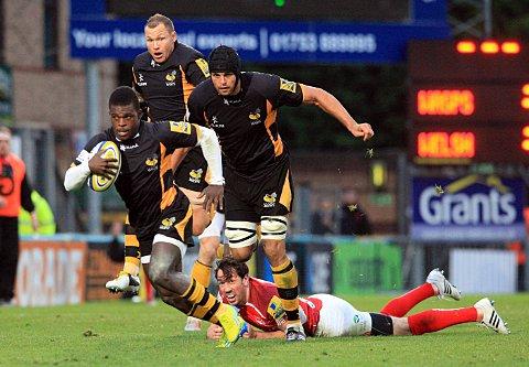 Fast paced: Former St Mary's University student Christian Wade leaves Welsh new boy Tom Voyce trailing in his wake on Sunday