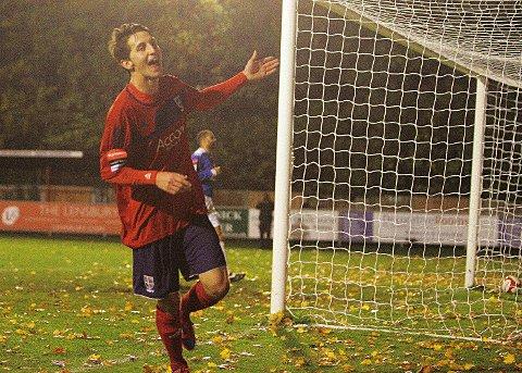 On our way: Charlie Moone slots celebrates his second goal and Hampton's third in Tuesday's 3-2 win over Leiston