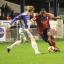 Tussle: Malvin Kamara launches a Hampton attack against Leiston