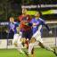Up for it: Joel Ledgister wins a header in midfield as Hampton progressed in the FA Trophy on Tuesday