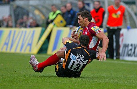 Tough love: Gavin Henson is felled against London Wasps