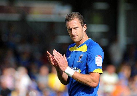 Midson matters: The Dons striker wants to write a new chapter in the club's history books and that means getting past the Franchise   SP68731