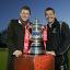 Brothers in arms: Goalkeeping legends Dave Beasant and Neil Sullivan get close up and personal with the most famous piece of club silverware in the world     SP72319