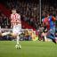 Wingman: Yannick Bolasie moves forward in the FA Cup tie against Stoke City with Ryan Shawcross in hot pursuit   SP72883
