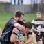 Hang on: Peter Matthews gives a lift to a Guildford player during Sutton's nailbiting win    SP72888