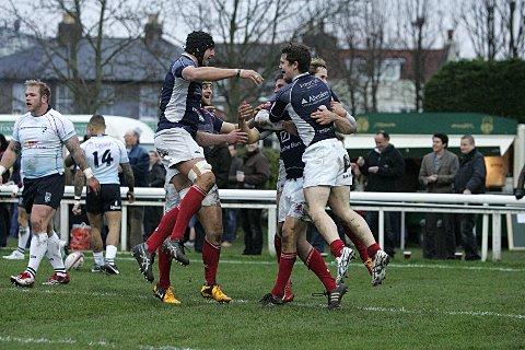 Get in: Scottish players celebrate Andy Reay's opennig score agaisnt Bedford Blues